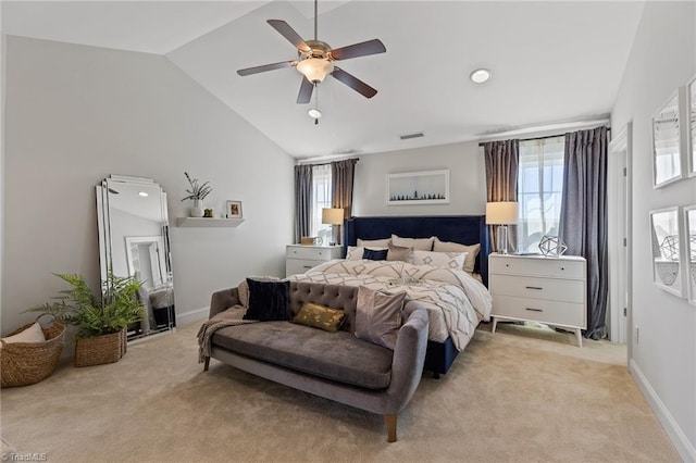 carpeted bedroom with ceiling fan and lofted ceiling