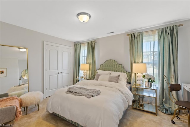 bedroom with carpet flooring and multiple windows