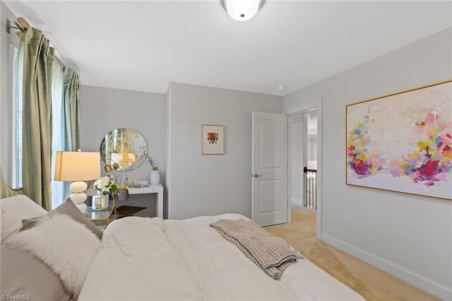 bedroom featuring light carpet