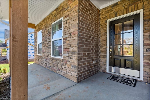 doorway to property with a porch