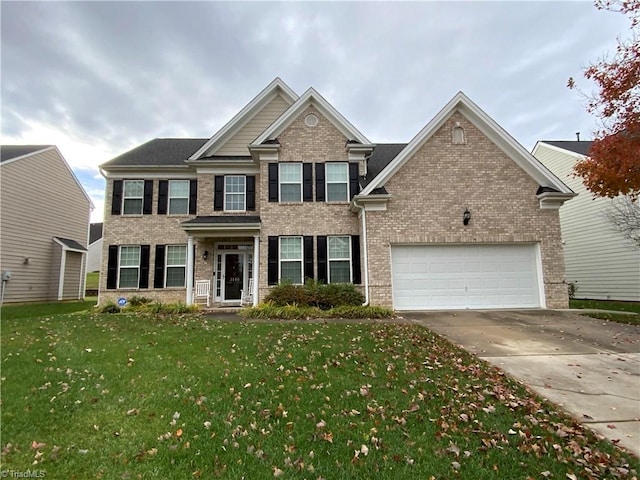 view of front of property with a front lawn and a garage