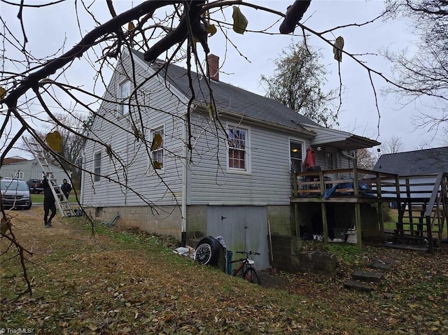 view of home's exterior featuring a deck