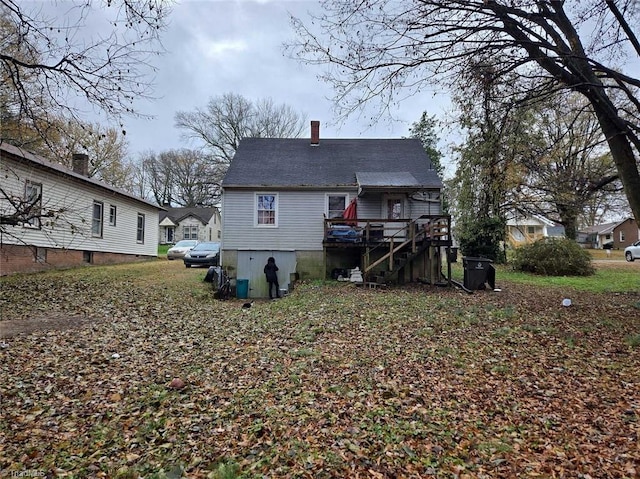 back of property featuring a deck