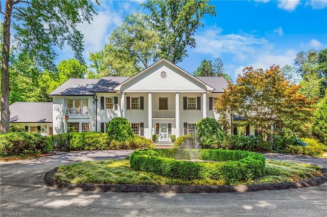 3500 Quarterstaff Pl, Winston-Salem, NC 27104 - greek revival inspired property featuring stucco siding, curved driveway, and french doors