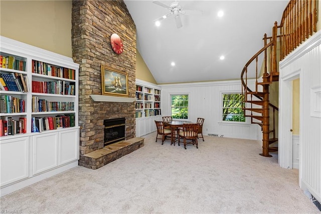 3500 Quarterstaff Pl, Winston-Salem, NC 27104 - dining space with a stone fireplace, stairs, carpet floors, lofted ceiling, and a ceiling fan