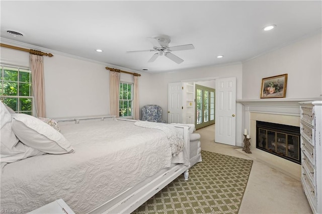 3500 Quarterstaff Pl, Winston-Salem, NC 27104 - bedroom with light carpet, ornamental molding, multiple windows, a fireplace with flush hearth, and recessed lighting