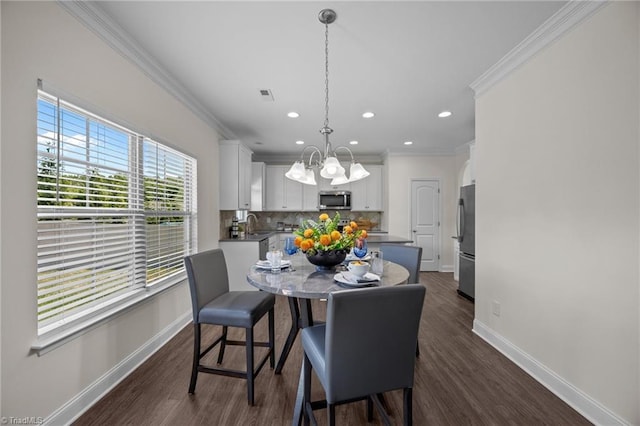 dining room featuring baseboards, a chandelier, ornamental molding, recessed lighting, and dark wood finished floors