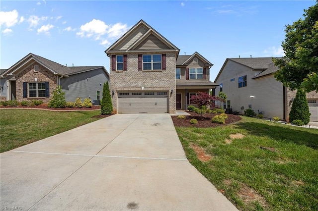 craftsman inspired home with brick siding, driveway, a garage, and a front lawn