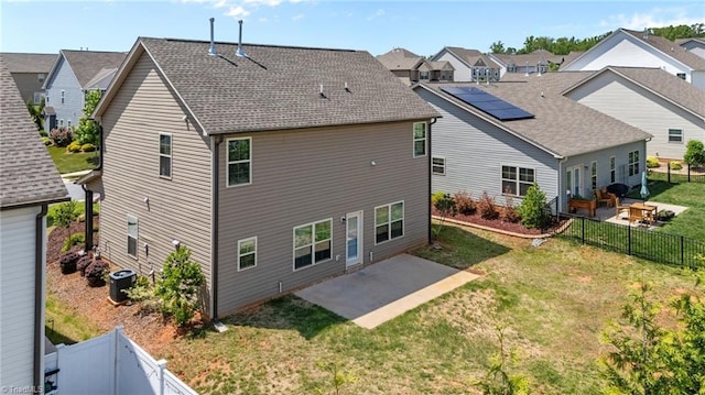 rear view of house with a patio area, central air condition unit, a residential view, and a shingled roof