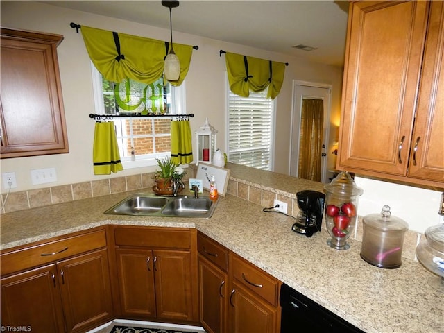 149 Pinewood Ln Unit 104, Bermuda Run, NC 27006 - kitchen with a sink, plenty of natural light, brown cabinets, and light countertops