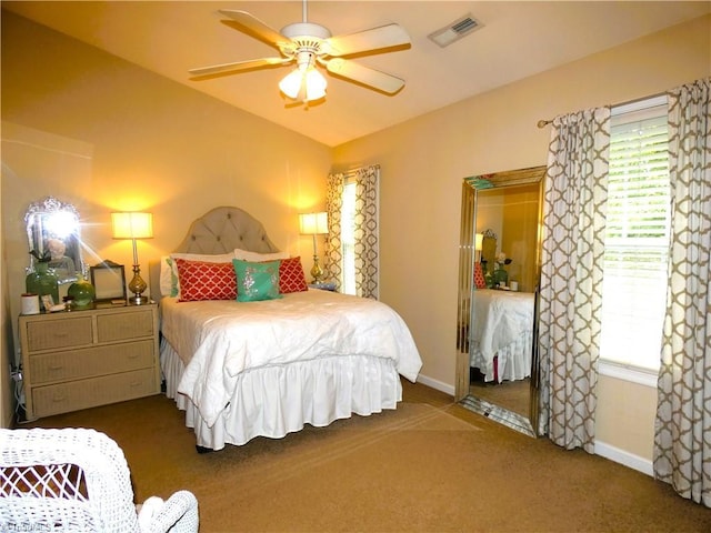 149 Pinewood Ln Unit 104, Bermuda Run, NC 27006 - carpeted bedroom with vaulted ceiling, multiple windows, baseboards, and a ceiling fan