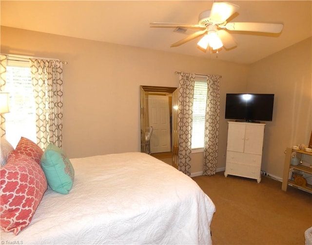 149 Pinewood Ln Unit 104, Bermuda Run, NC 27006 - carpeted bedroom with ceiling fan and baseboards