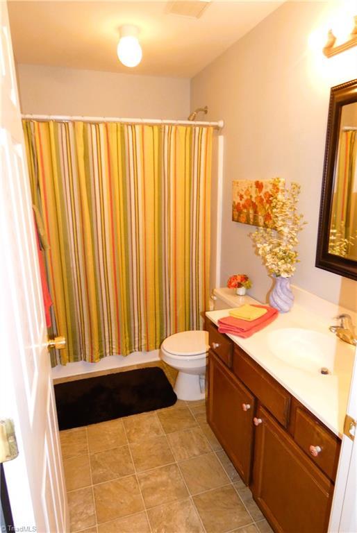 149 Pinewood Ln Unit 104, Bermuda Run, NC 27006 - bathroom with vanity and toilet