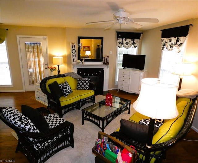 149 Pinewood Ln Unit 104, Bermuda Run, NC 27006 - living room featuring ceiling fan, a fireplace, wood finished floors, and baseboards