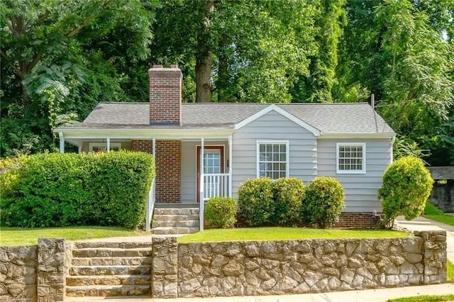 1134 W End Blvd, Winston-Salem, NC 27101 - view of front of home with covered porch, a chimney, and roof with shingles