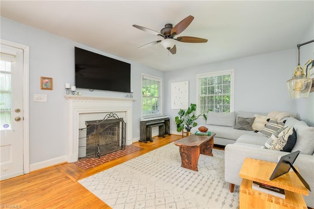 1134 W End Blvd, Winston-Salem, NC 27101 - living area with wood finished floors, ceiling fan, and a fireplace with flush hearth
