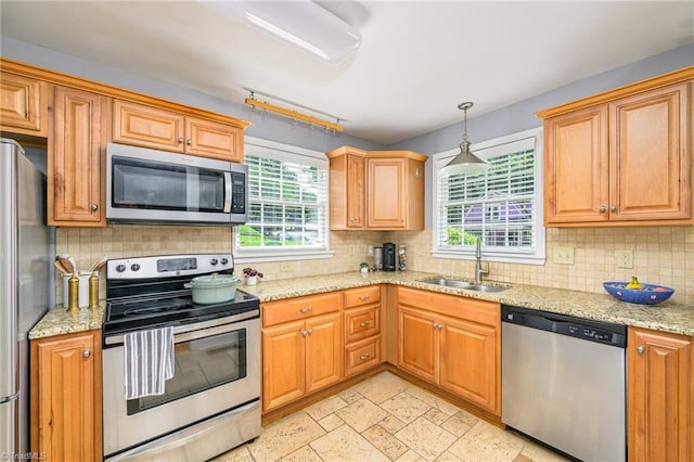 1134 W End Blvd, Winston-Salem, NC 27101 - kitchen featuring appliances with stainless steel finishes, decorative backsplash, and light stone counters