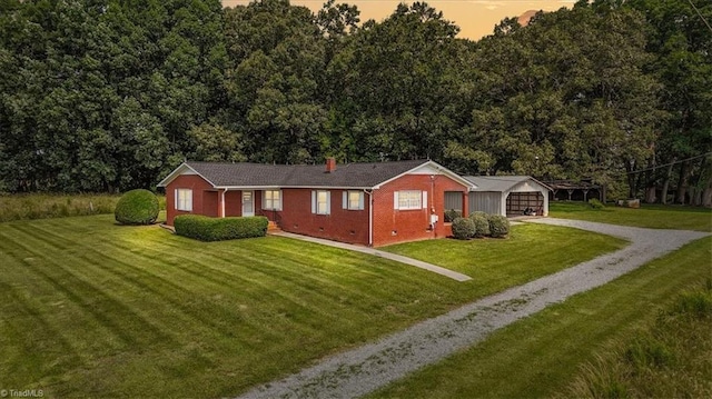 6277 Bennett Rd, Seagrove, NC 27341 - view of front facade with gravel driveway, a yard, and brick siding
