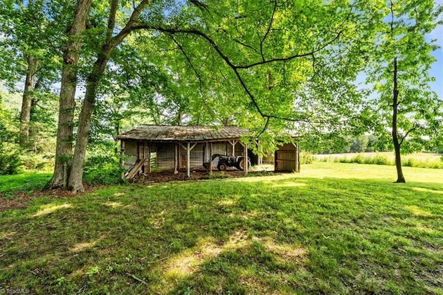 6277 Bennett Rd, Seagrove, NC 27341 - view of grassy yard featuring a pole building and an outbuilding