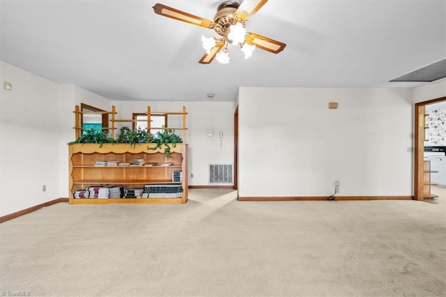 6277 Bennett Rd, Seagrove, NC 27341 - living room with carpet flooring, baseboards, and ceiling fan