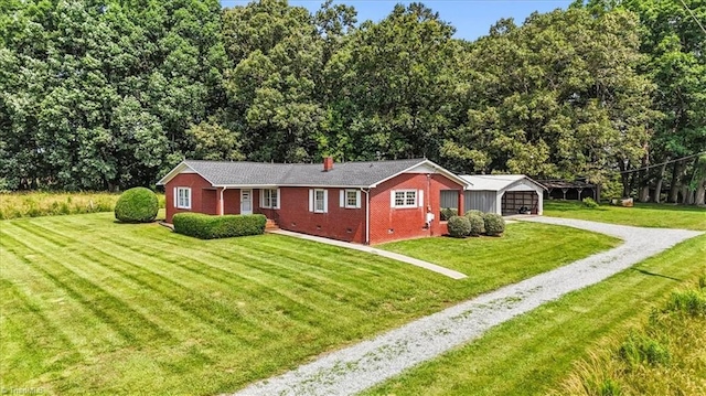 6277 Bennett Rd, Seagrove, NC 27341 - single story home featuring gravel driveway, a front lawn, brick siding, a chimney, and a garage