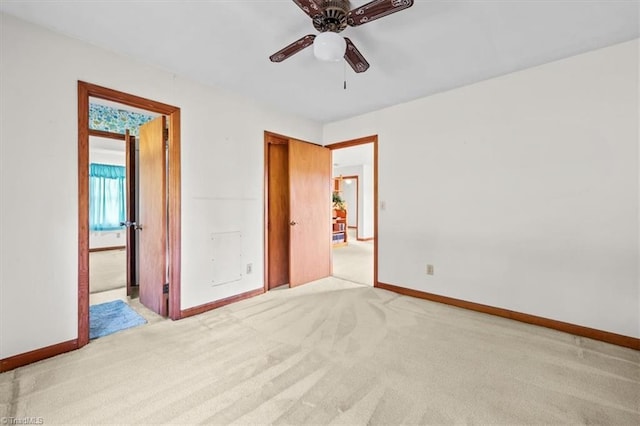 6277 Bennett Rd, Seagrove, NC 27341 - unfurnished bedroom featuring light colored carpet, baseboards, connected bathroom, and a ceiling fan