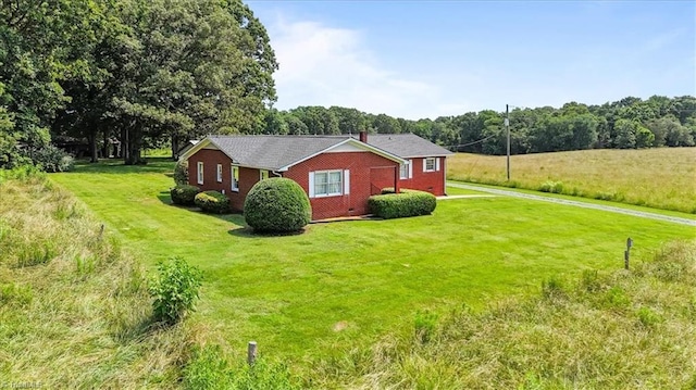 6277 Bennett Rd, Seagrove, NC 27341 - view of property exterior featuring a lawn, driveway, and brick siding