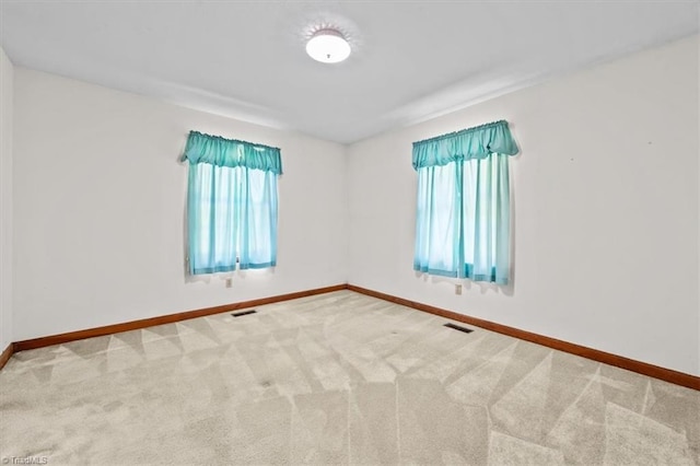 6277 Bennett Rd, Seagrove, NC 27341 - carpeted spare room featuring baseboards and healthy amount of natural light