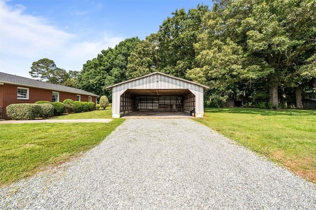 6277 Bennett Rd, Seagrove, NC 27341 - garage featuring gravel driveway and a carport