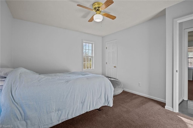 bedroom featuring ceiling fan and dark colored carpet