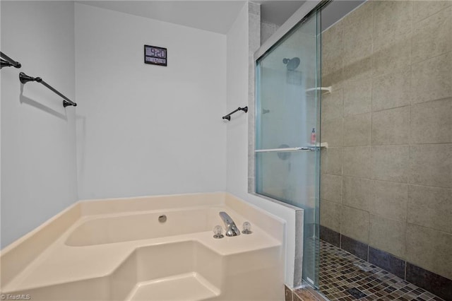 bathroom with shower with separate bathtub