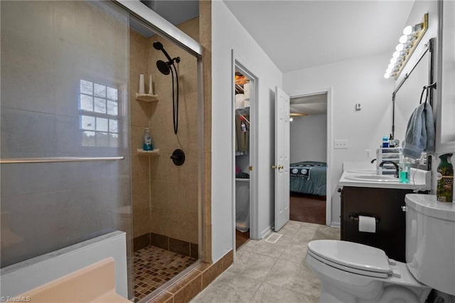 bathroom with vanity, toilet, and an enclosed shower