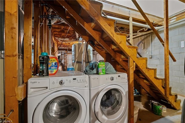 clothes washing area with washing machine and clothes dryer