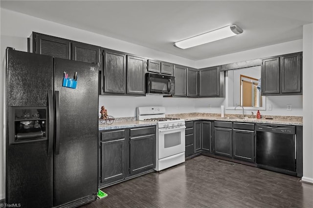 kitchen featuring sink, dark hardwood / wood-style floors, and black appliances