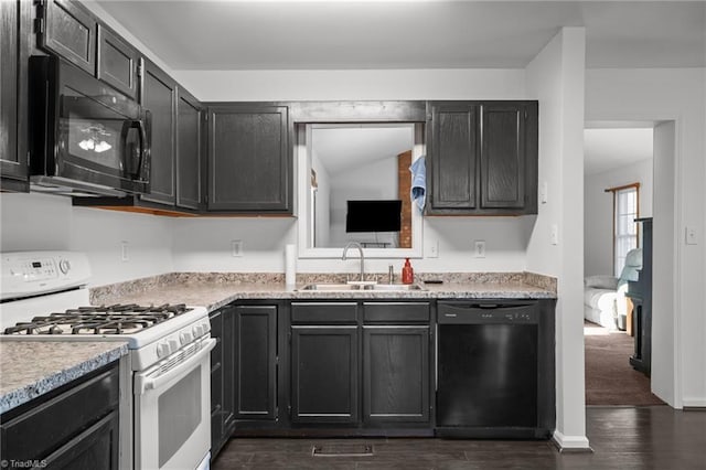 kitchen with sink, black appliances, and dark hardwood / wood-style flooring