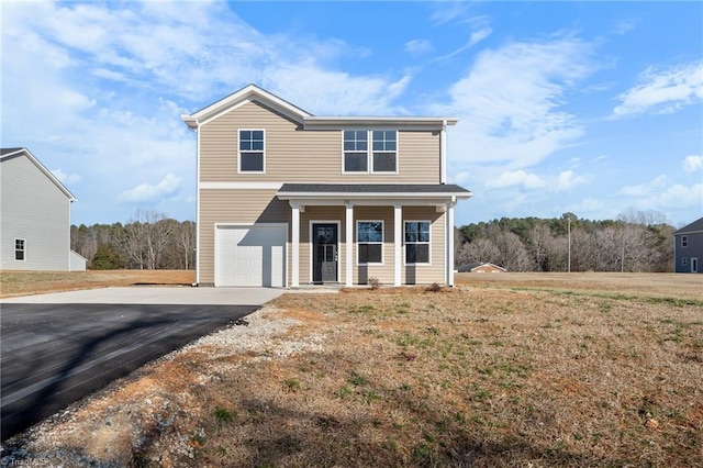 view of front of house featuring a garage, a porch, and a front lawn