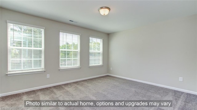4090 Stallion St Lot 74, High Point, NC 27262 - empty room featuring carpet floors and baseboards