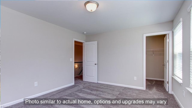 4090 Stallion St Lot 74, High Point, NC 27262 - unfurnished bedroom featuring carpet, a spacious closet, and a closet