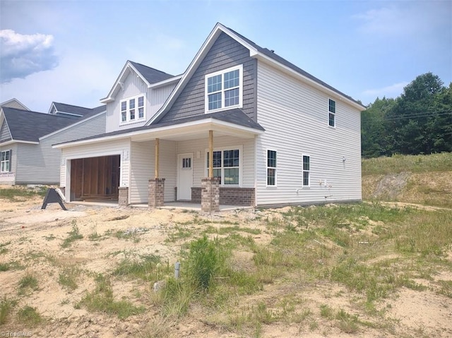 4090 Stallion St Lot 74, High Point, NC 27262 - view of front of house featuring covered porch and an attached garage