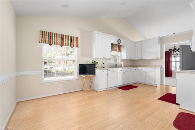 kitchen featuring white cabinetry, lofted ceiling, light hardwood / wood-style floors, and plenty of natural light