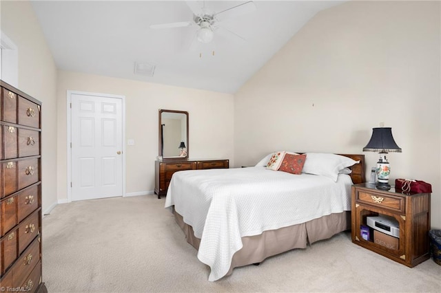 carpeted bedroom with vaulted ceiling and ceiling fan