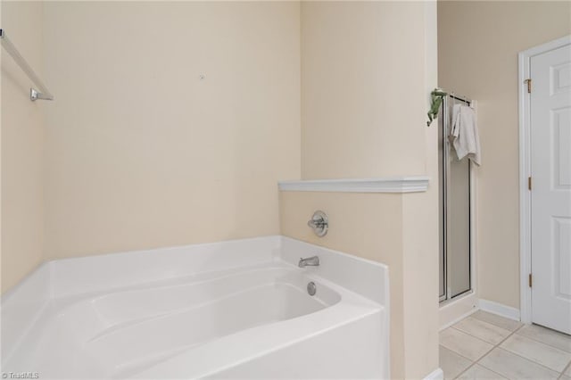 bathroom featuring tile patterned floors and a bathing tub