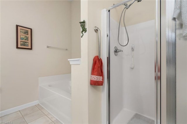 bathroom with tile patterned floors and plus walk in shower