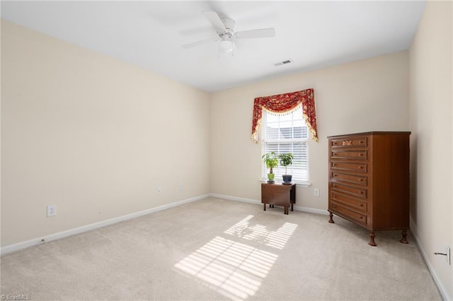 bedroom featuring light colored carpet and ceiling fan