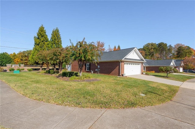 view of front of property with a garage and a front lawn