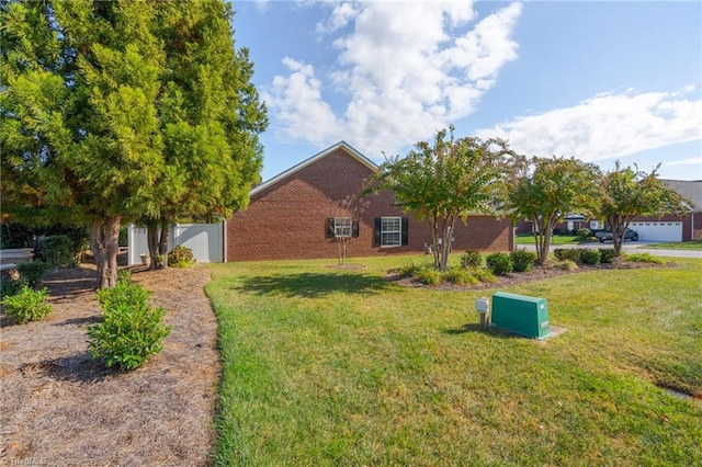 view of yard featuring a garage