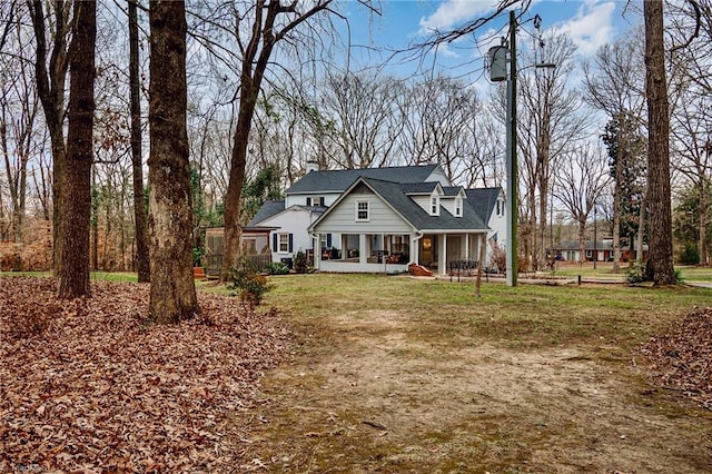 view of front of house featuring a front yard and covered porch