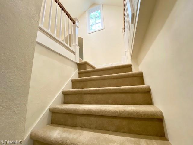 305 W Avondale Dr, Greensboro, NC 27403 - stairs featuring high vaulted ceiling