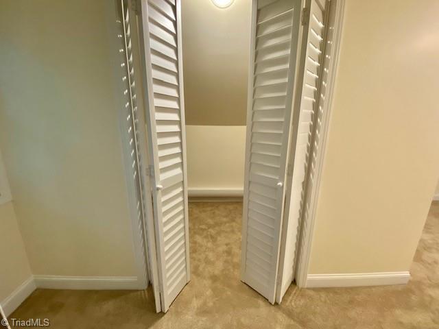 305 W Avondale Dr, Greensboro, NC 27403 - hallway featuring light carpet and baseboards