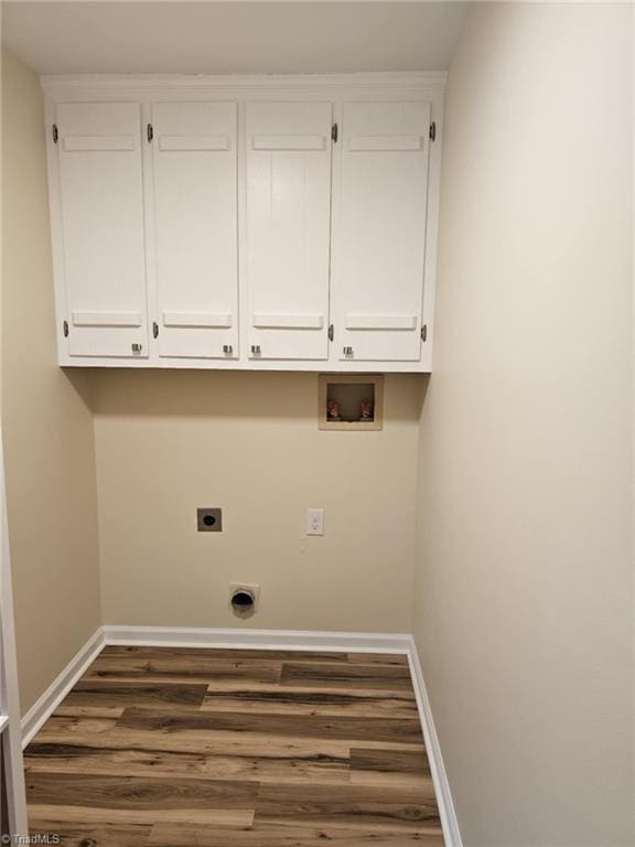 laundry room featuring washer hookup, cabinet space, electric dryer hookup, and baseboards